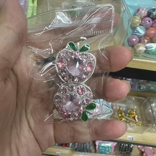 Two pink apple beads